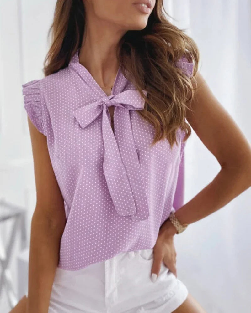 Elegante ärmellose Bluse mit Rüschen und Schleifendetail